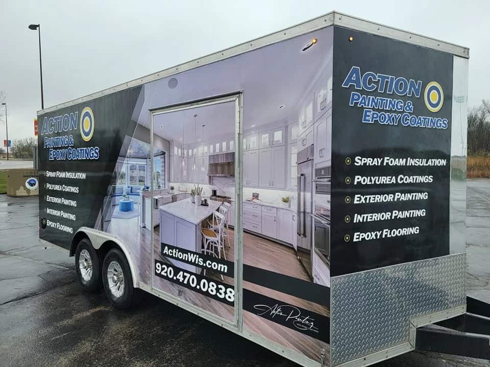 Branded trailer for Action Painting & Epoxy Coatings showing list of services