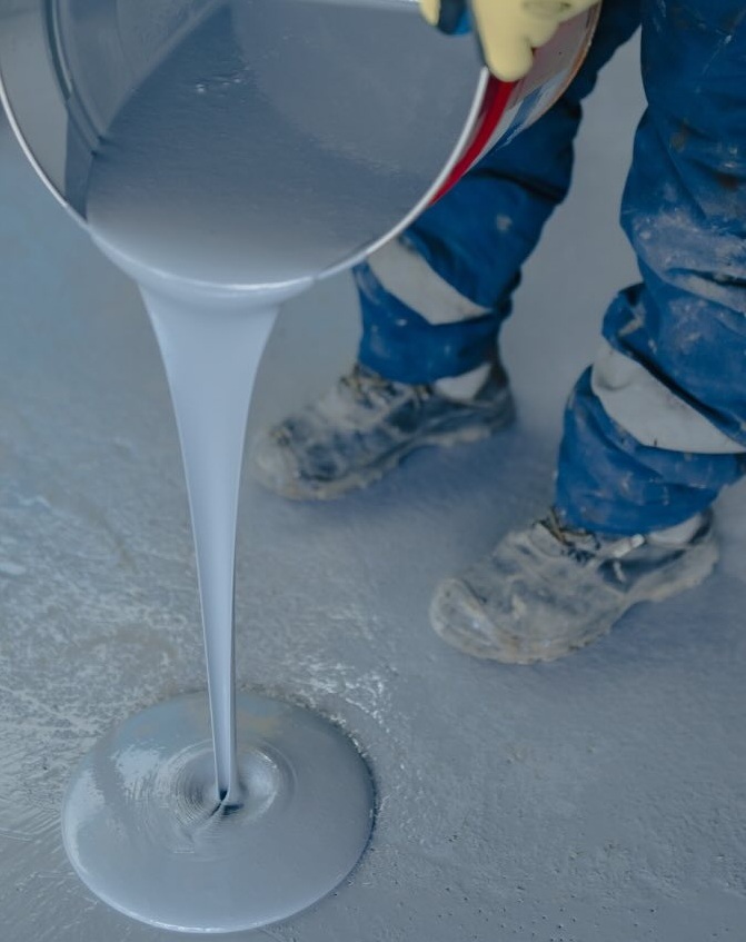 Pouring epoxy floor coating material during installation