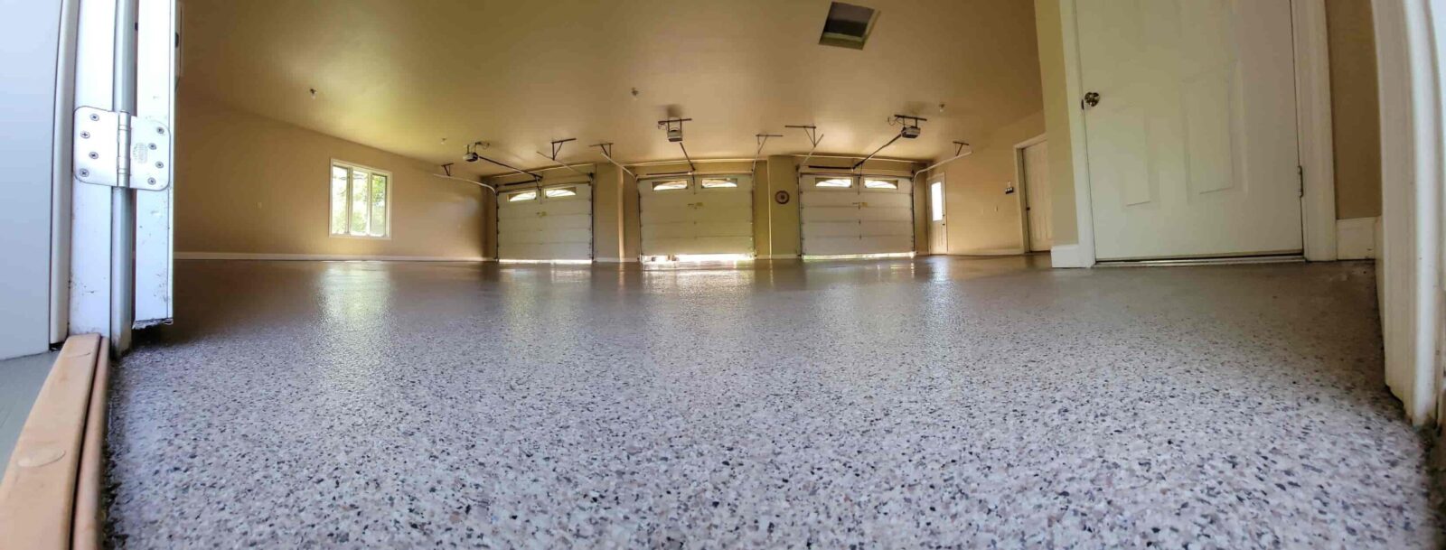 Garage floor coating installation in Wisconsin home.